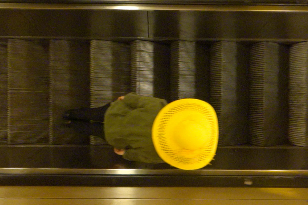 person on escalator
